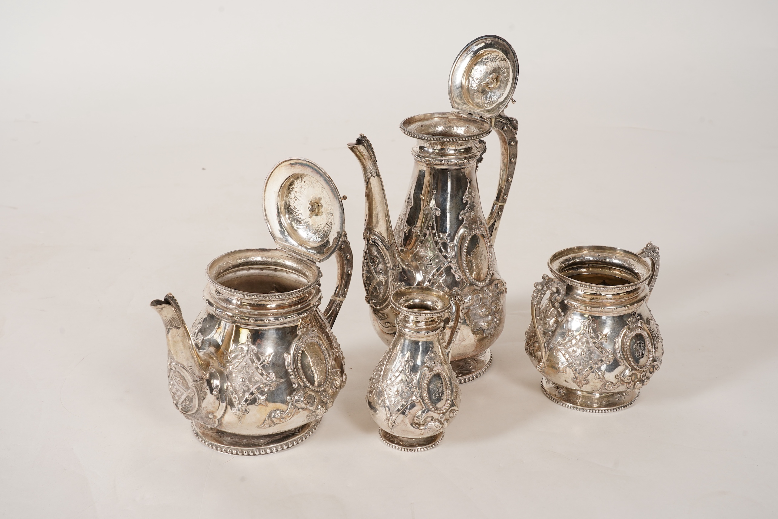 A Victorian ornate silver four piece tea and coffee service, by Thomas Smily